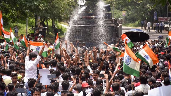 India students clash with police over exam scandal