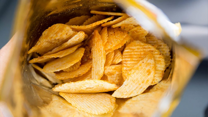 Why are potato chip Bags half empty?